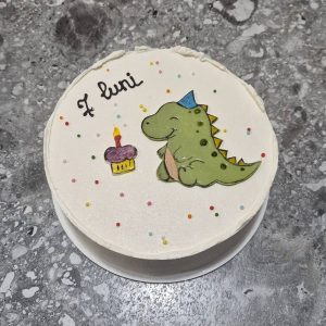 Bento tort alb cu desen de dinozaur și lumânare, decorat cu steluțe colorate și text „7 luni”, Emys Cakes